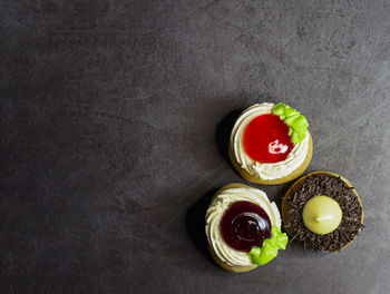 High angle view of fruits in glass on black background