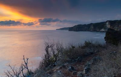 Scenic view of sea against sky during sunset
