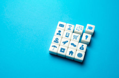 Close-up of dices on blue background