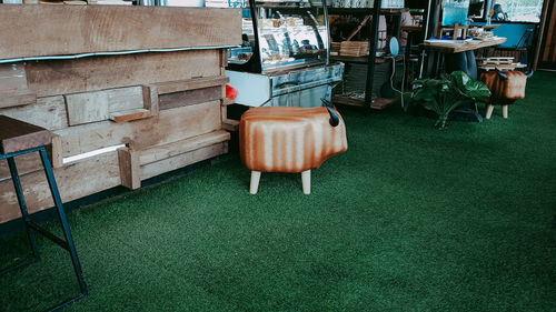 High angle view of chairs on table against wall