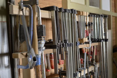 Close-up of clothes hanging in row