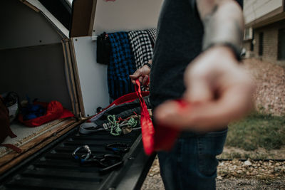Man preparing climbing ropes for rock climbing