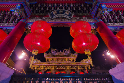 Low angle view of illuminated temple building