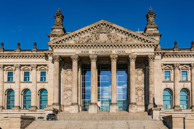 The view worth seeing from the square of the republic on the building of german reichstag in berlin