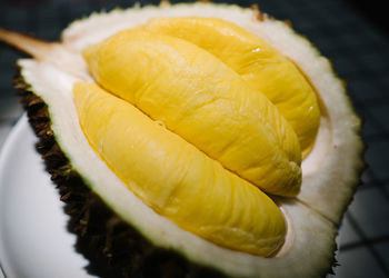 Close-up of lemon slice in plate