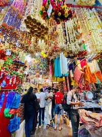 Rear view of people at market stall