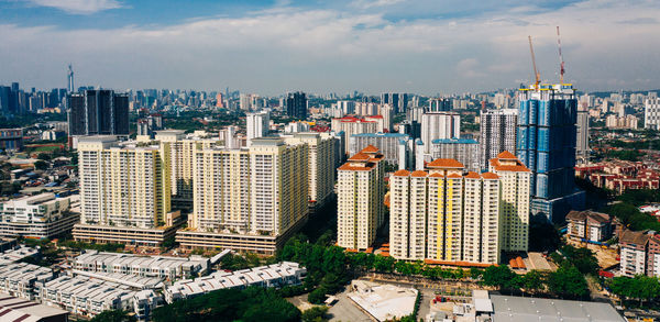 Modern buildings in city against sky