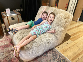 Portrait of boy lying on floor at home