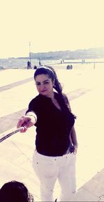 Portrait of woman standing on beach