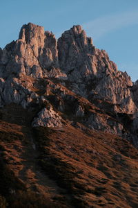 Low angle view of rock formation against sky