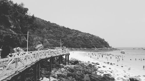 Bridge over sea against clear sky