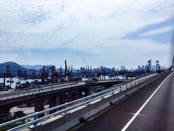 High angle view of highway against sky in city