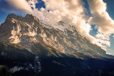 Low angle view of mountain range against sky