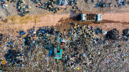 Garbage pile in trash dump or landfill, aerial view garbage trucks unload garbage to a landfill,