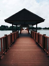 Pier over sea against sky