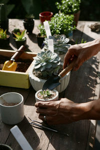 Midsection of person having food on table