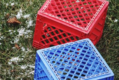 Close-up high angle view of milk crates 