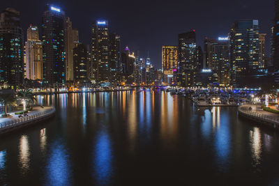 Illuminated buildings in city at night