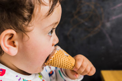 Close-up of girl eating ice cream