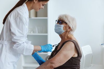 Midsection of woman wearing mask