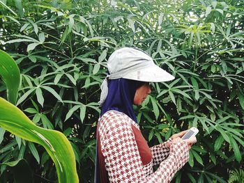 Woman wearing hat on field