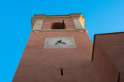 Low angle view of clock tower against sky