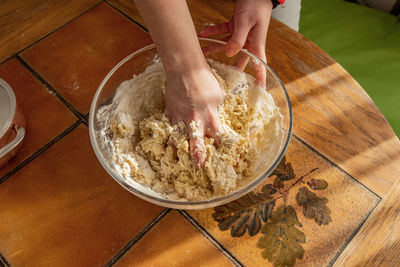 High angle view of woman preparing food on table