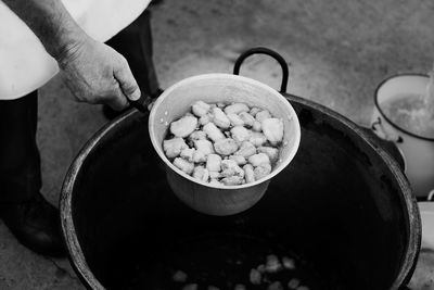 Midsection of man preparing food