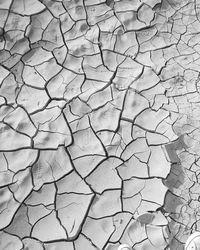 Full frame shot of cracked soil or clay