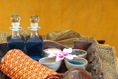 Close-up of decanters on table at spa