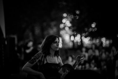 Portrait of woman sitting outdoors