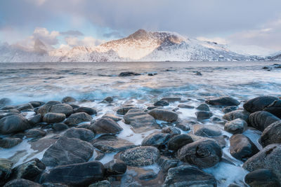 Scenic view of sea and rocks against sky