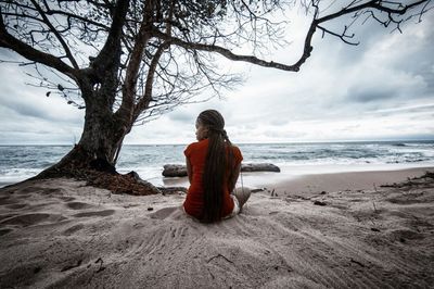 Scenic view of sea against cloudy sky