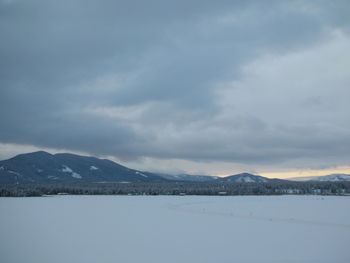 Scenic view of mountains against sky during winter