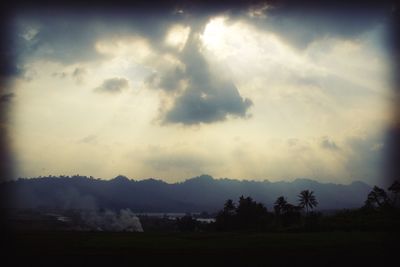 Scenic view of landscape against cloudy sky