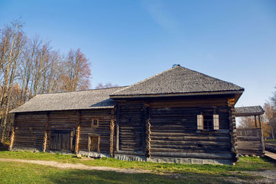 Large old log house in autumn in the village