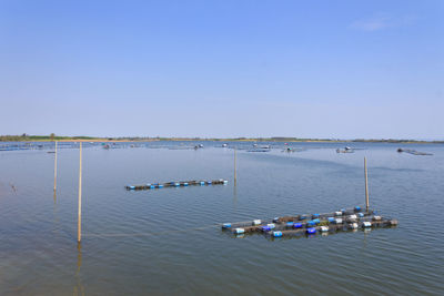 High angle view of boats in sea against clear sky