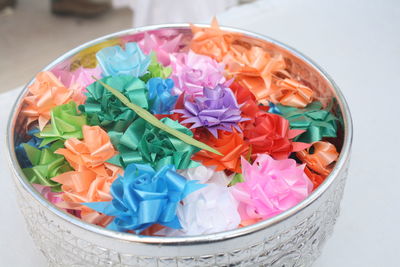 High angle view of multi colored flowers in bowl on table