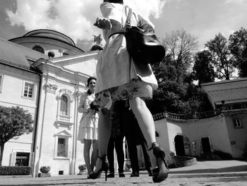 Low angle view of woman against sky