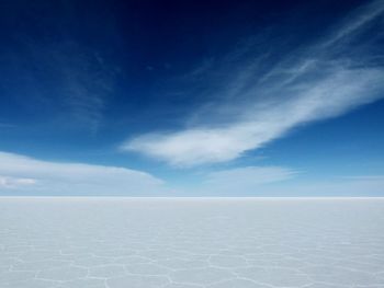 Scenic view of landscape against cloudy sky