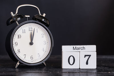 Close-up of clock on table