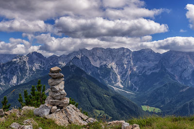 Scenic view of mountains against cloudy sky