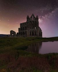 Old building against sky at night