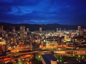 High angle view of illuminated buildings in city at night