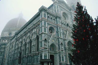 Low angle view of duomo santa maria del fiore in foggy weather