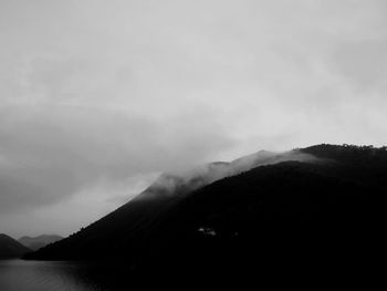 Scenic view of silhouette mountains against sky