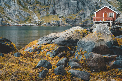 Rock formations by sea against sky