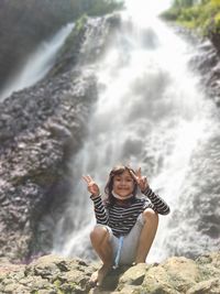 Portrait of mature man on rock