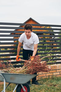 Young man working in yard 