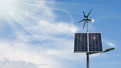 Low angle view of wind turbine against sky